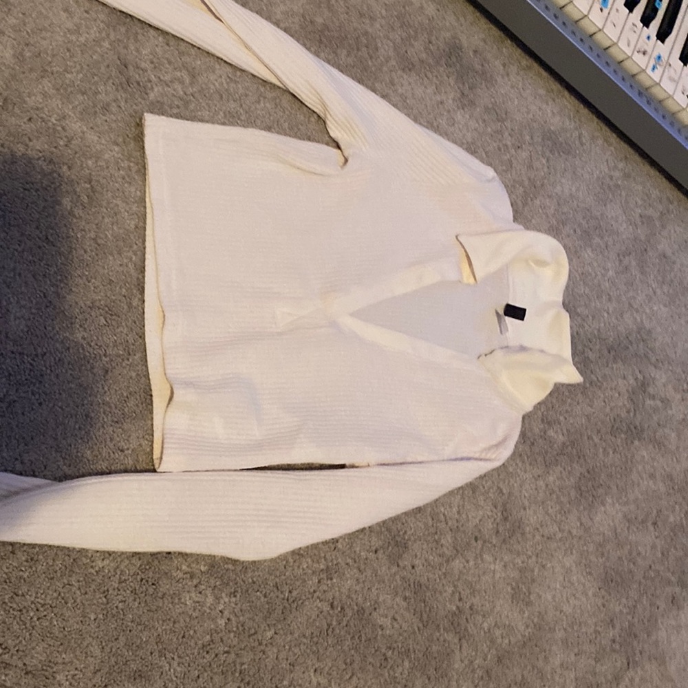 A white tank top with an open collar